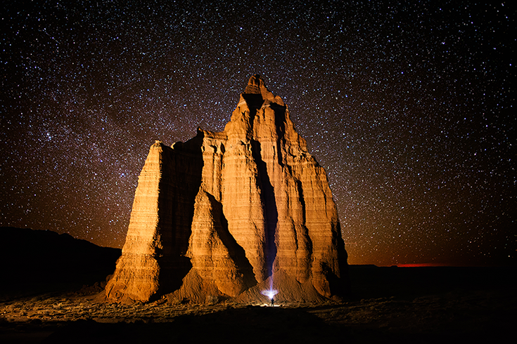 Rocky monolith against starry night sky in Capitol Reef National Park, Utah.