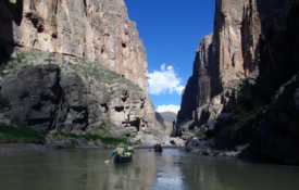 canoeing through a canyon in the desert southwest