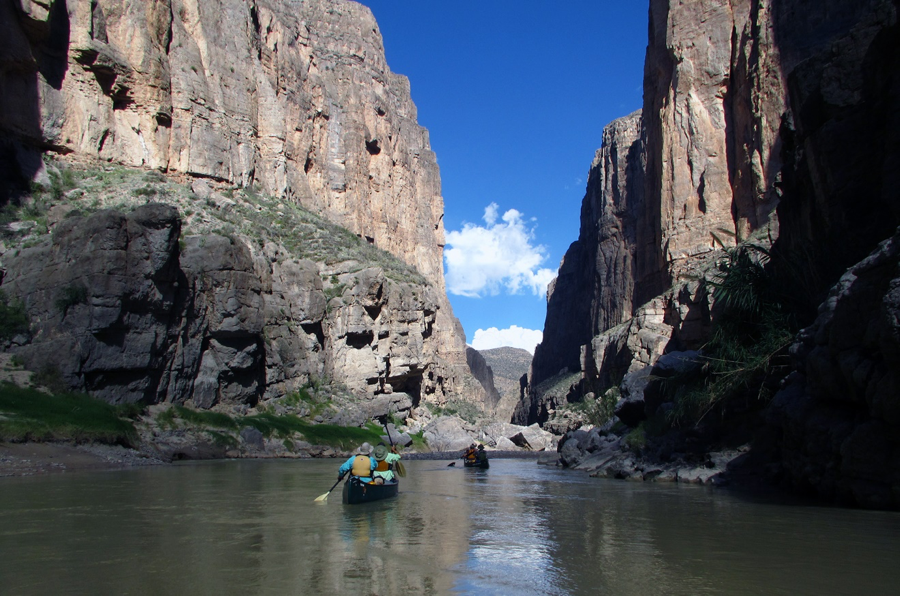 canoeing through a canyon in the desert southwest
