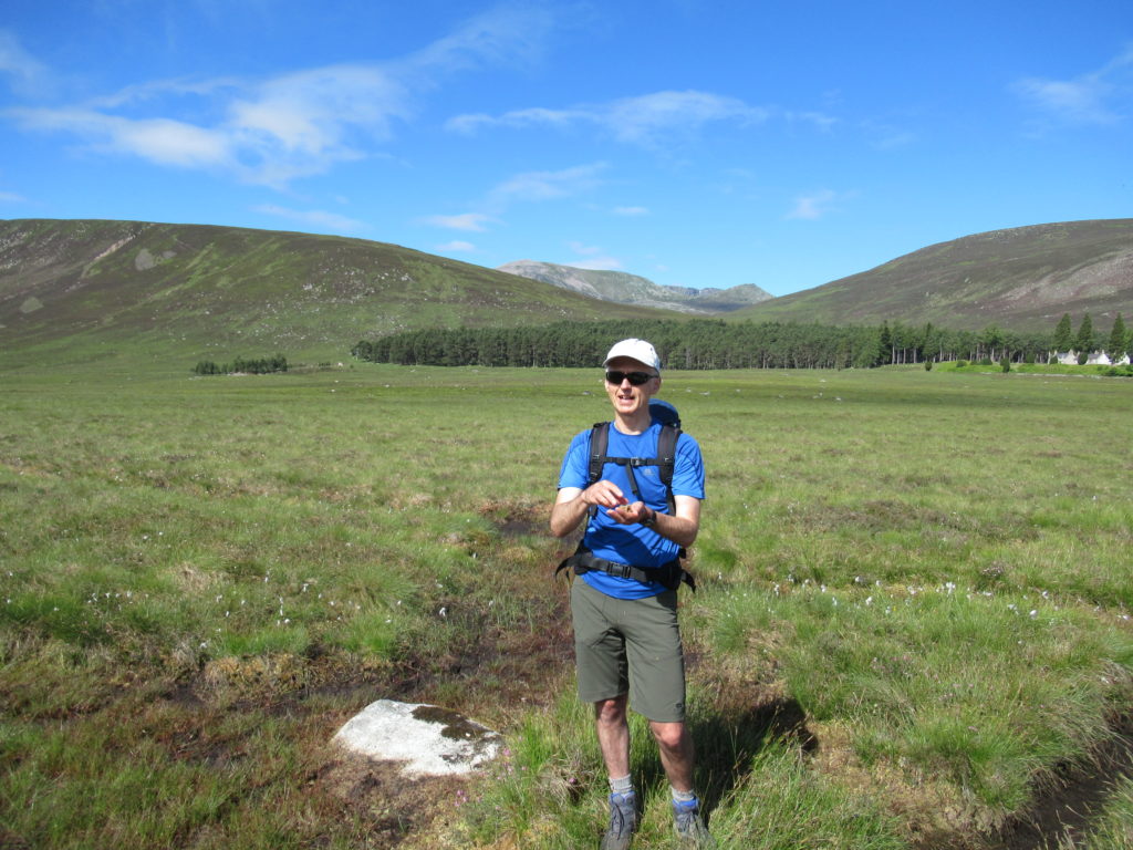 Explaining the natural history and historical uses of sphagnum moss on a walk in Scotland