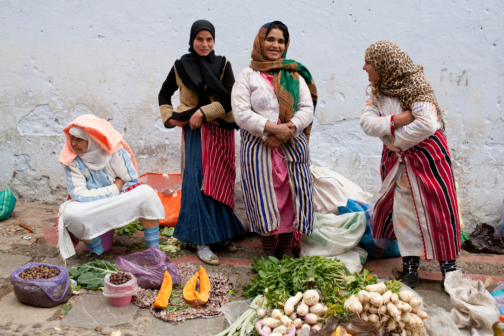 Smiling women in a souk in the Chefchaouen medina market in Morocco