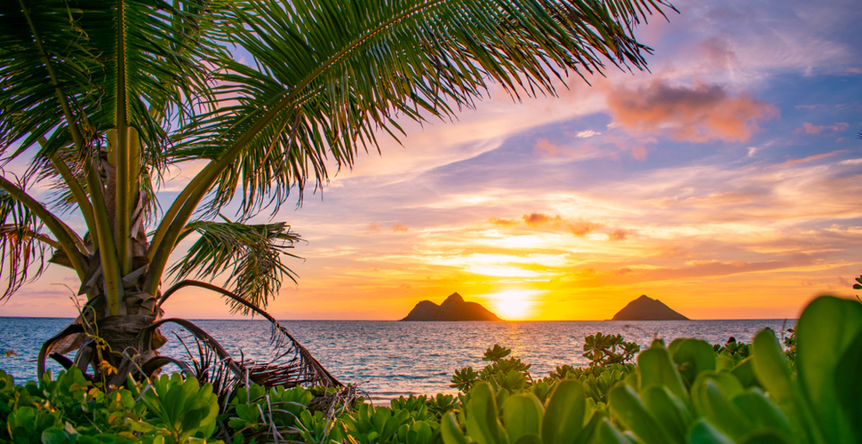 Sunset at Lanikai Beach Hawaii with a view of the Mokes