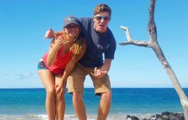 Brother and sister ham it up on the beach in Hawaii