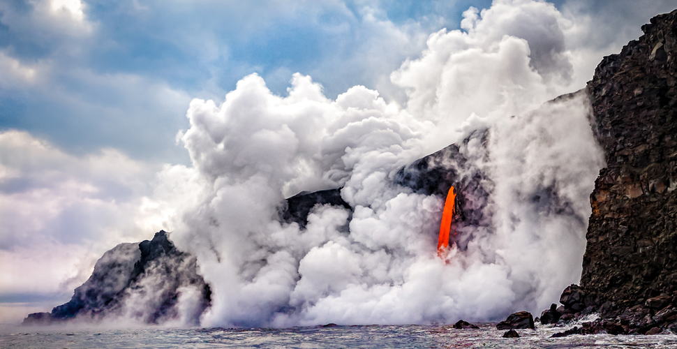 Lava and steam pour into the ocean at Hawaii Volcanoes National Park