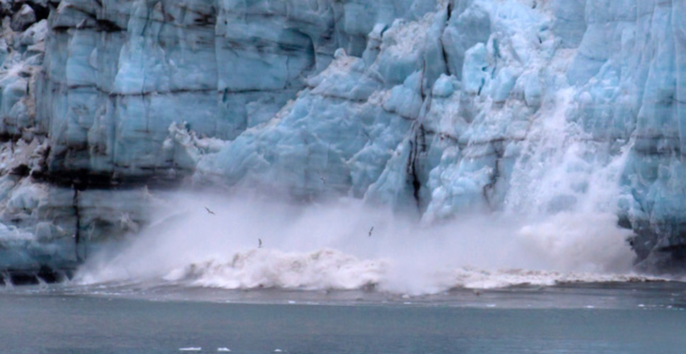 A glacier in Glacier Bay National Park sheds a big chunk into the bay