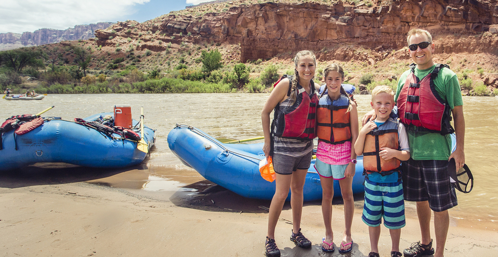 A young family takes a break from rafting on the Colorado River