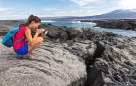 Woman taking pictures in the Galapagos Islands