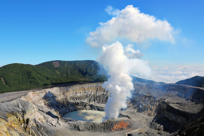 Costa Rica's Poas Volcano steams into the blue sky