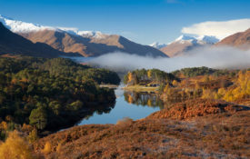 Looking west along Loch Affric to snow topped mountains
