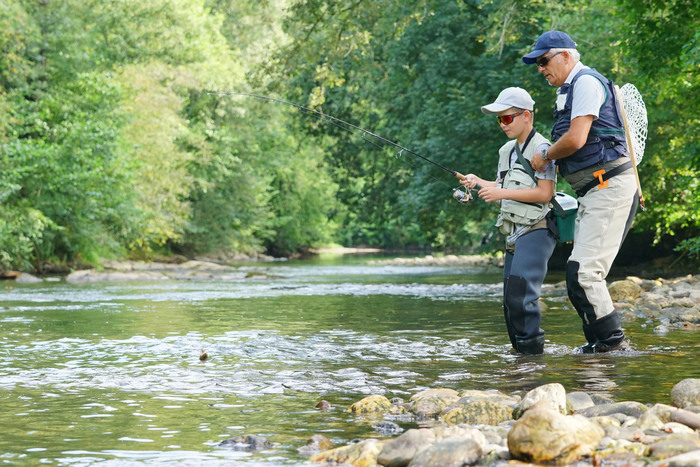 Grandpa and grand son fly fishing