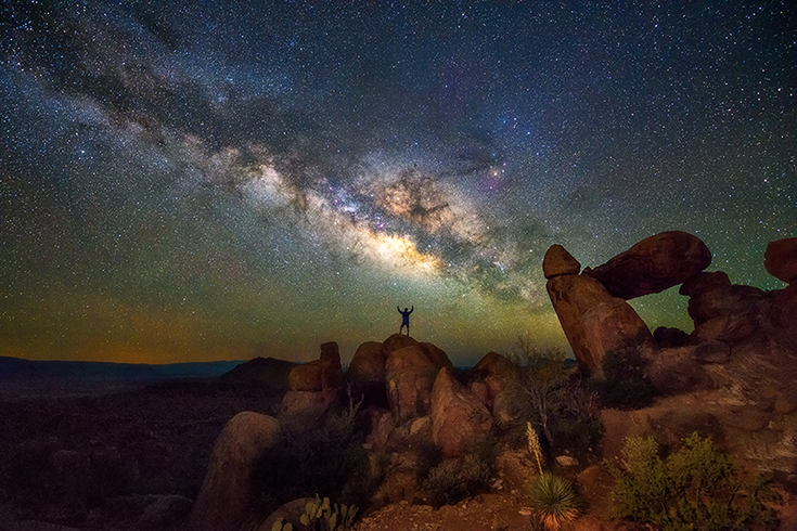 Galaxy in night sky above iconic landscapes of Big Bend National Park, Texas.