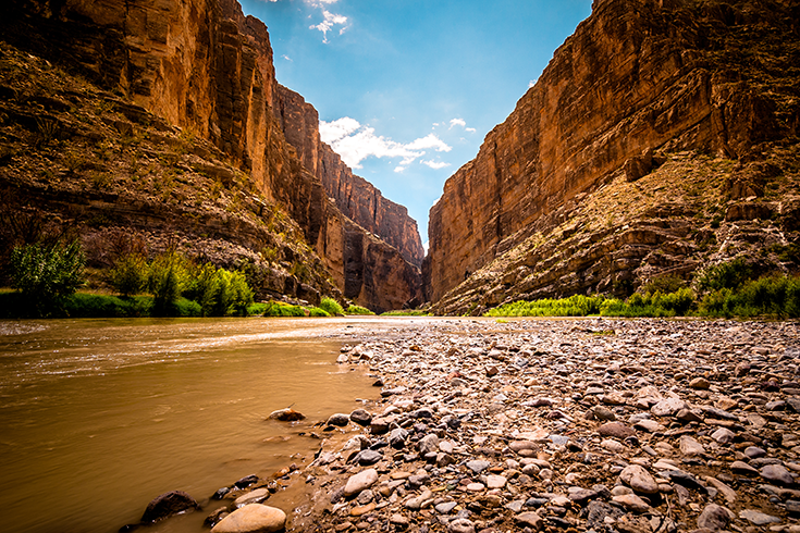Big Bend. a river floats gently through a large canyon.