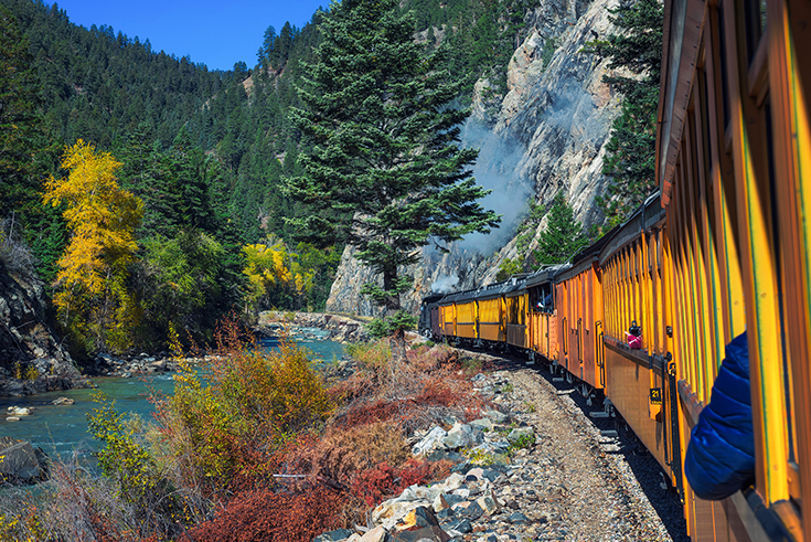 A train ride next to a river through Colorado near Silverton