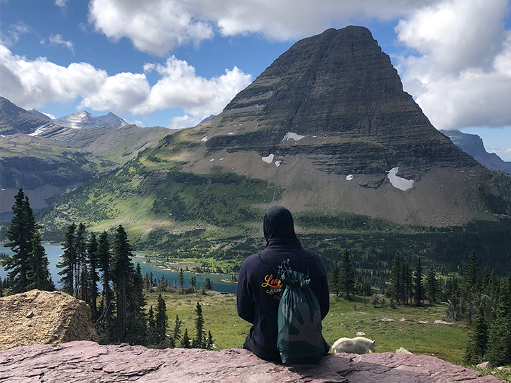 Ryan peering out at Bearhat Mountain and Hidden Lake in Glacier National Park.