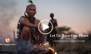 man sitting at fire talking about culture during an off the beaten path safari in botswana